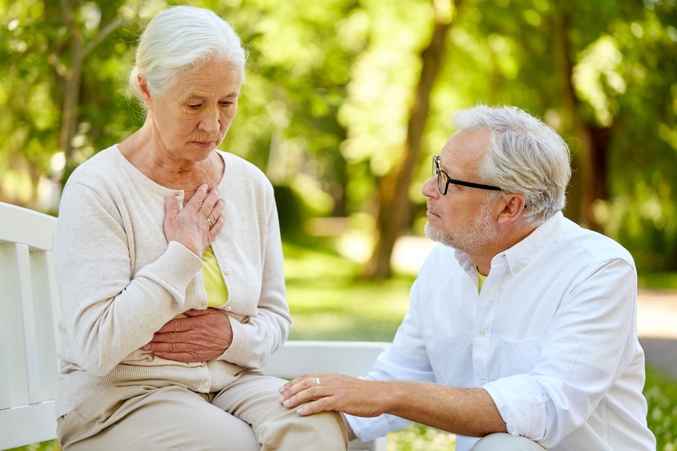 old age, health problem and people concept - senior woman feeling sick at summer park