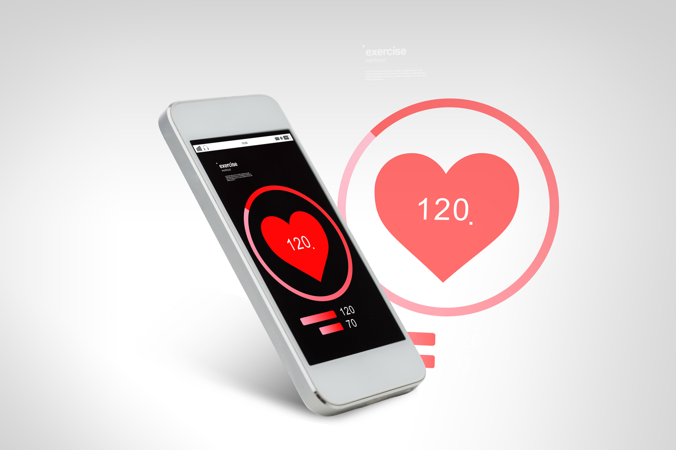 technology, health care, application and electronics concept - white smarthphone with red heart icon screen