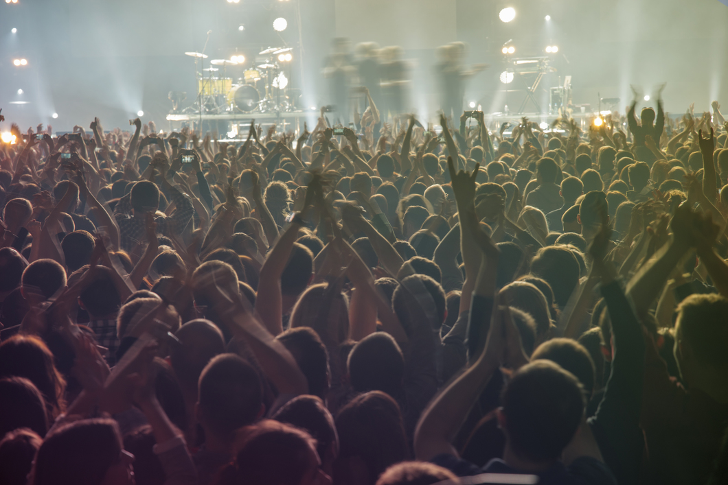 People at the concert are waiting for the show