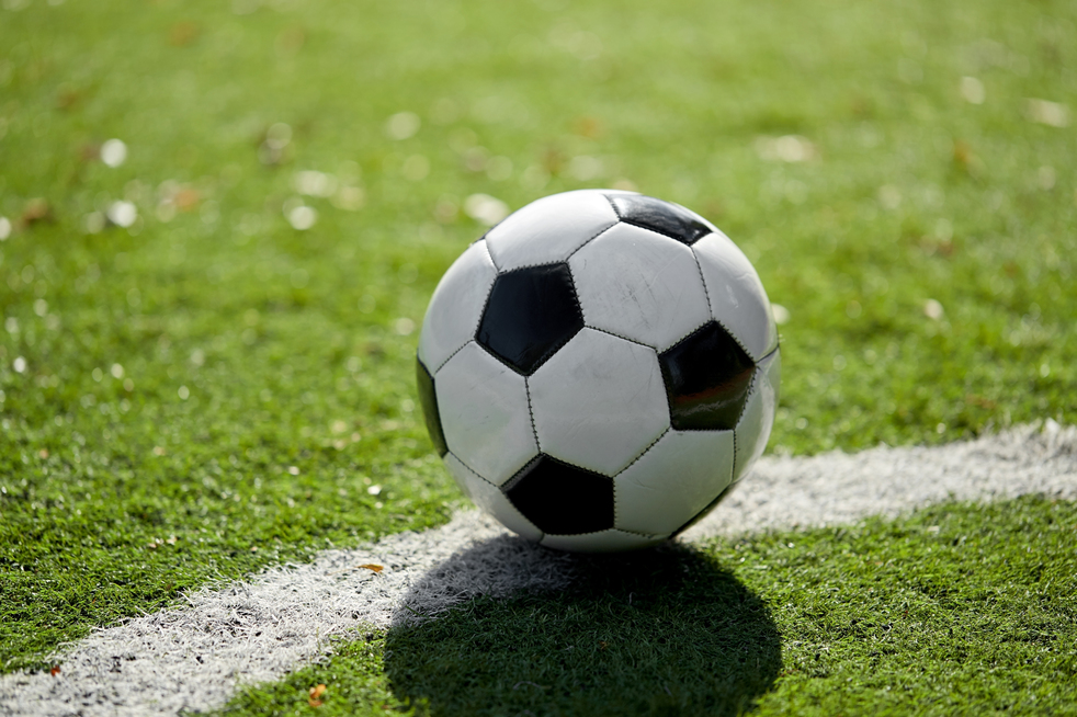 sport, soccer and game - ball on football field