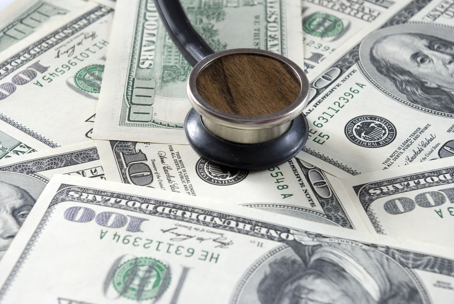 Stethoscope on money background of  dollars